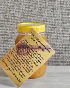 Raw Natural honey with propolis side view